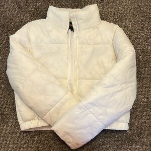 White puffer jacketed, size medium, stained